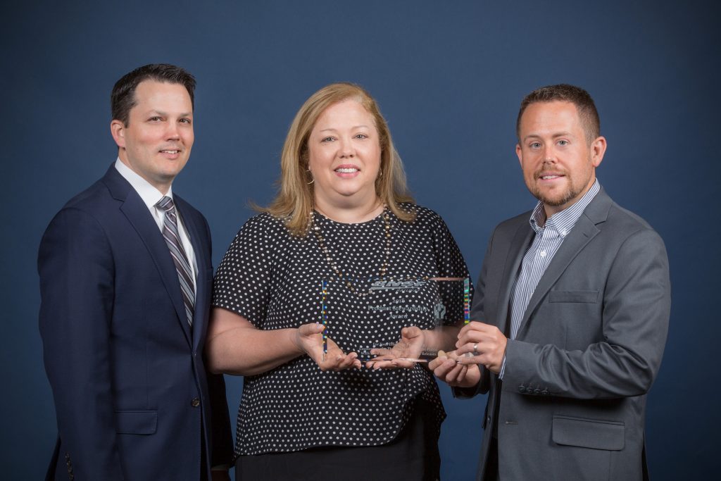 Pictured from left to right: Ryan Dreier with BNSF and Amy David and Chris Scherer with Methanex.