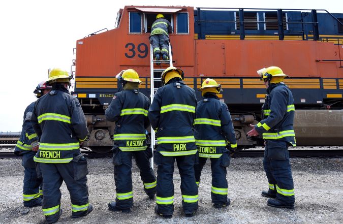 Emergency response training includes mock drills using actual rail equipment.