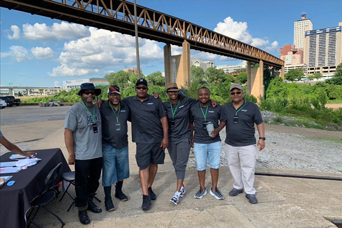 Members of BNSF’s Memphis Diversity Council volunteering along the Mississippi River harbor.