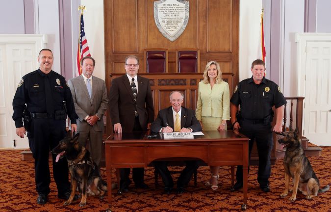 Railroad Police K-9 Protection Bill signing by Alabama Governor Robert Bentley. BNSF Senior Special Agent Bryan Schaffer and Faust are at left. 