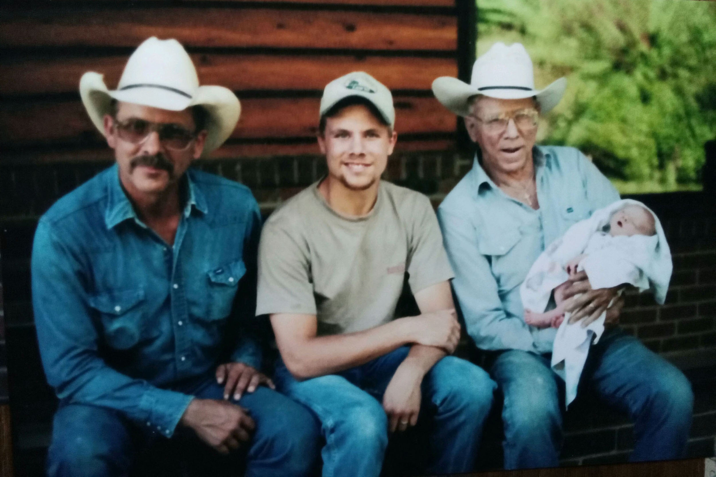 From left to right: Greg Hampson, Ben Hampson and Bill Hampson holding Ben’s son, Thad