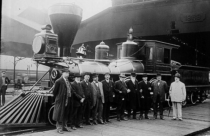 James J. Hill (center) in front of restored St. Paul and Pacific locomotive, the William Crooks (1914)