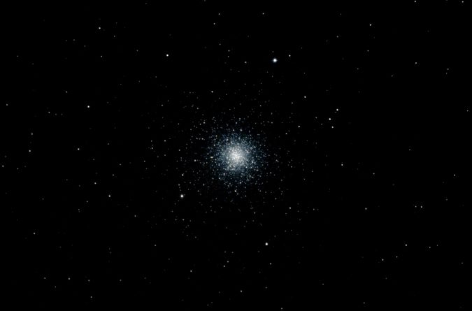 This is Fortner’s image of the globular cluster M3. It is one of about 400 globular clusters that orbit the Milky Way. They are dense balls of stars only a few light years across. They resemble the cores of captured dwarf galaxies but are thought to have formed independently of galaxies, and maybe before many galaxies. 