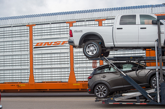 A BNSF autorack car used to carry vehicles is loaded at our auto facility in Pearland, Texas.