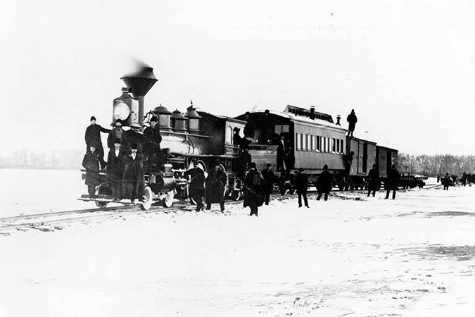 A Northern Pacific train crosses the Missouri River on tracks over the ice near Bismarck, North Dakota in March 1879.