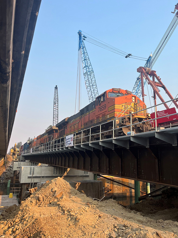 The first train runs across the new bridge on Aug. 3. The first train runs across the new bridge on Aug. 3.