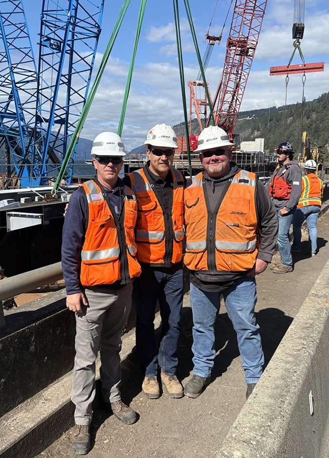 BNSF team members on the bridge replacement site. From left, Jeff Swanson, general director of line maintenance; Edmundo Rodriguez, general manager; and Chad Gordon, manager of structures. BNSF team members on the bridge replacement site. From left, Jeff Swanson, general director of line maintenance; Edmundo Rodriguez, general manager; and Chad Gordon, manager of structures.