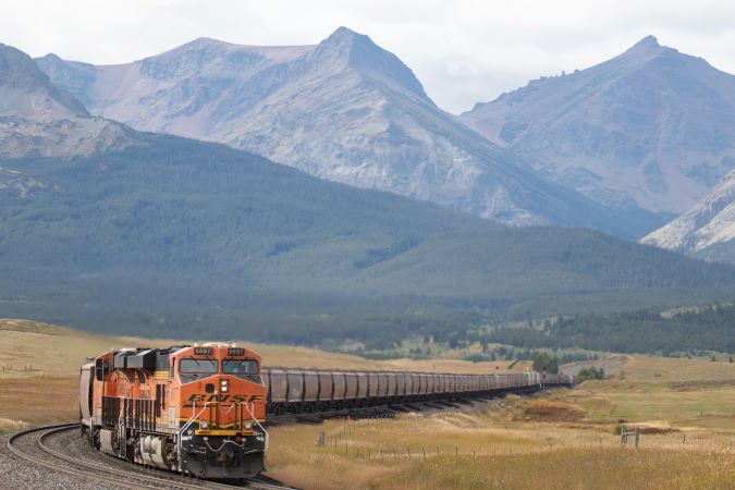 BNSF train and mountains in the back. 