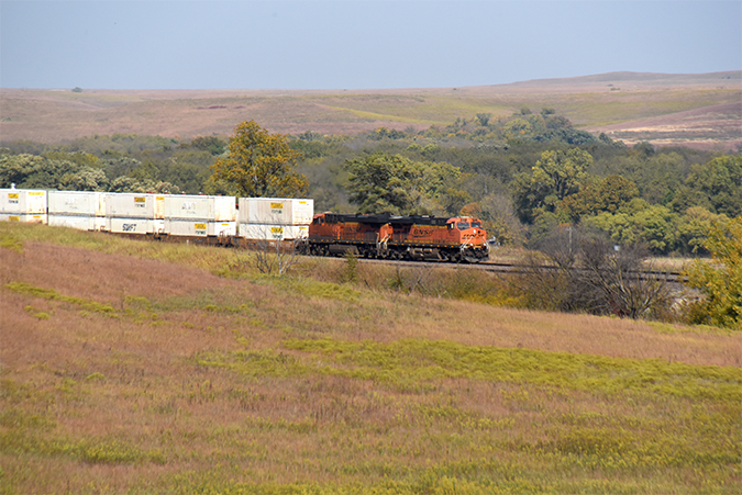 A BNSF intermodal train rolls through the Flint Hills near Hornbeck’s route.